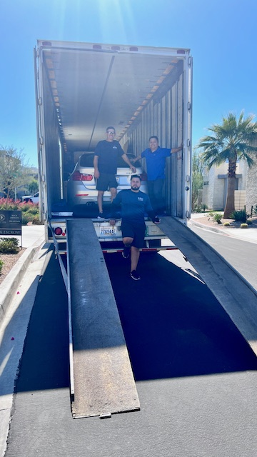 Lake Union Movers crew loading a car inside the truck on a long-distance move